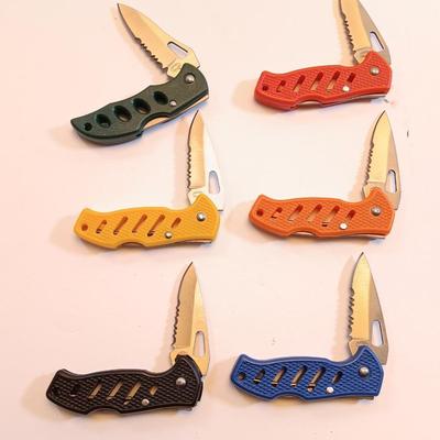 Six pocketknives each a different color