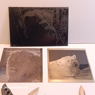 Three laser art tiles - Owls- lion and polar near with two pocketknives