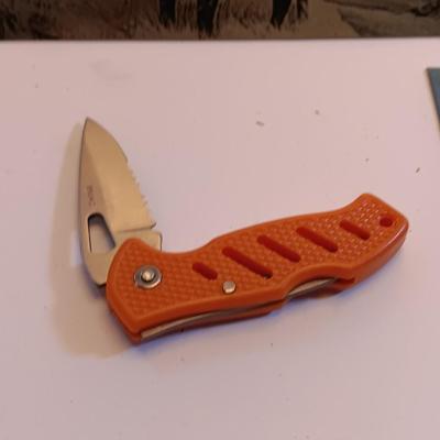 Three laser art tin / metal elk - squirrel - and Polar bear with two pocketknives