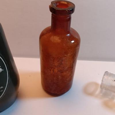 Vintage glass bottles and crock like bottles