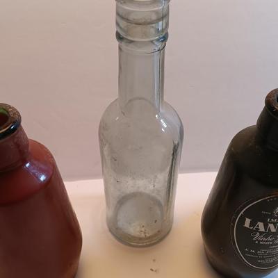 Vintage glass bottles and crock like bottles