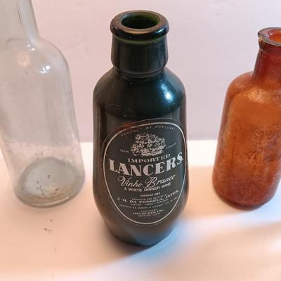Vintage glass bottles and crock like bottles