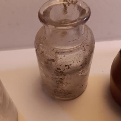 Vintage glass bottles and crock like bottles