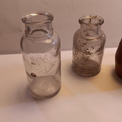 Vintage glass bottles and crock like bottles