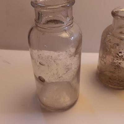 Vintage glass bottles and crock like bottles