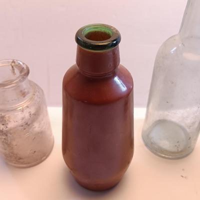 Vintage glass bottles and crock like bottles