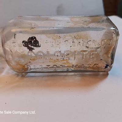 Vintage glass bottles and crock like bottles