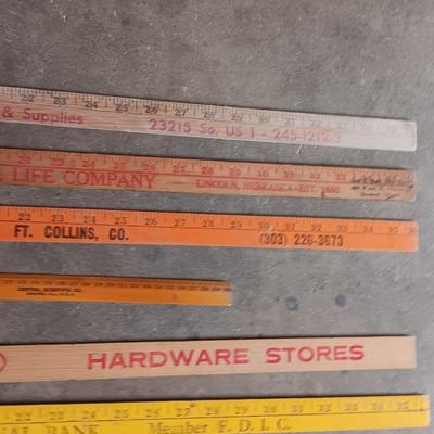 Collection of wooden yard sticks