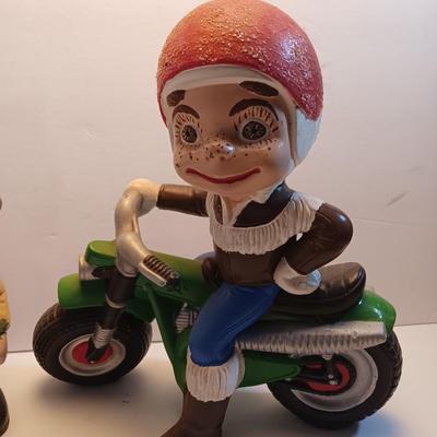 Vintage Atlantic Mold company Boy on motorbike and boy planting flowers