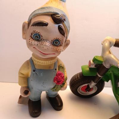 Vintage Atlantic Mold company Boy on motorbike and boy planting flowers