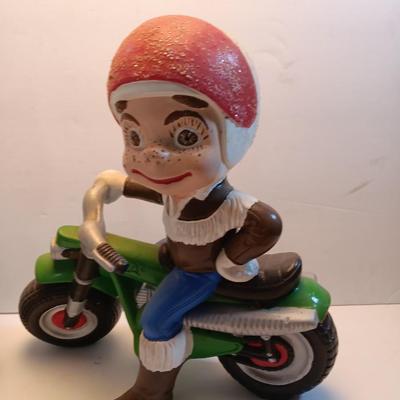 Vintage Atlantic Mold company Boy on motorbike and boy planting flowers