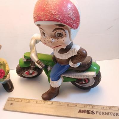 Vintage Atlantic Mold company Boy on motorbike and boy planting flowers