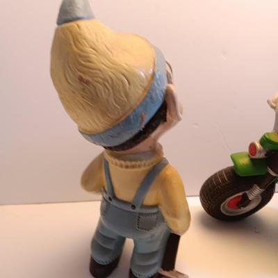 Vintage Atlantic Mold company Boy on motorbike and boy planting flowers