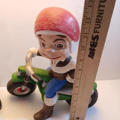 Vintage Atlantic Mold company Boy on motorbike and boy planting flowers