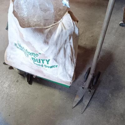 Antique canvas heavy duty fertilizer and seed Co, spreader and other Antique yard tools