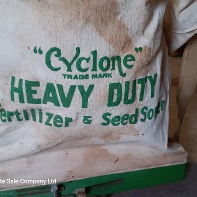 Antique canvas heavy duty fertilizer and seed Co, spreader and other Antique yard tools