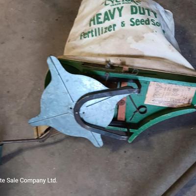 Antique canvas heavy duty fertilizer and seed Co, spreader and other Antique yard tools