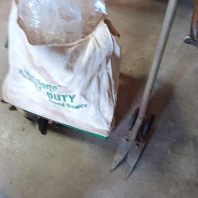 Antique canvas heavy duty fertilizer and seed Co, spreader and other Antique yard tools
