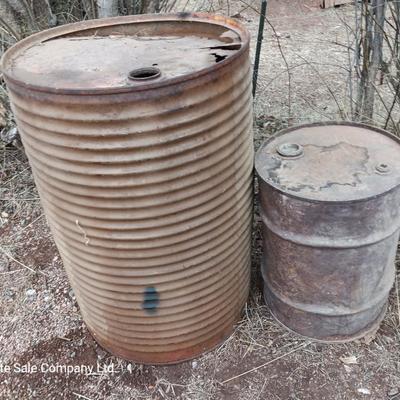 Two antique steel barrels