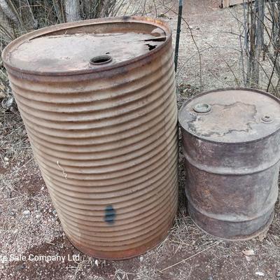 Two antique steel barrels
