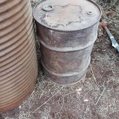 Two antique steel barrels