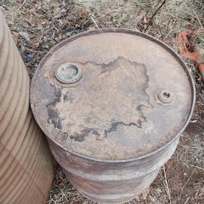 Two antique steel barrels