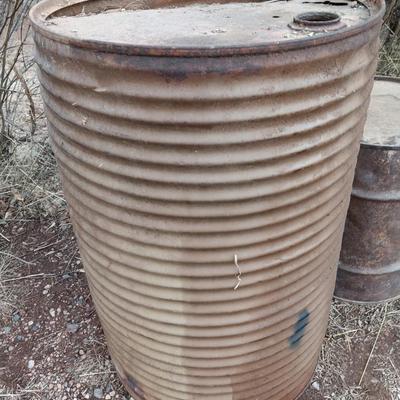 Two antique steel barrels