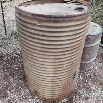 Two antique steel barrels