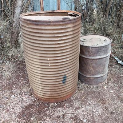 Two antique steel barrels