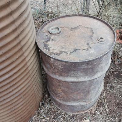 Two antique steel barrels