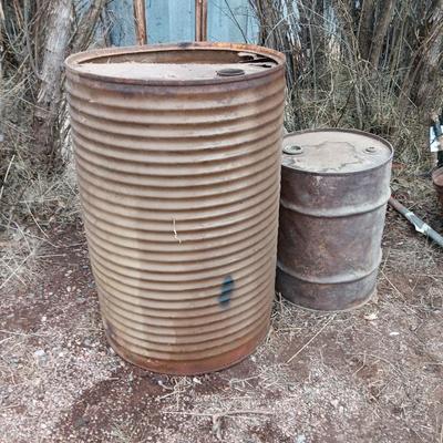 Two antique steel barrels