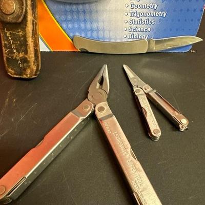 Lot 567, Casio scientific calculator, two Leatherman tools, and one buck knife