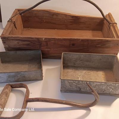 Antique wooden box with two metal boxes some old bottles and a vintage hay hook