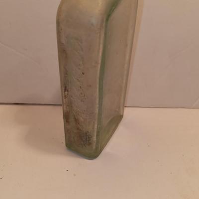 Antique wooden box with two metal boxes some old bottles and a vintage hay hook