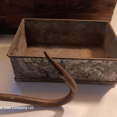 Antique wooden box with two metal boxes some old bottles and a vintage hay hook