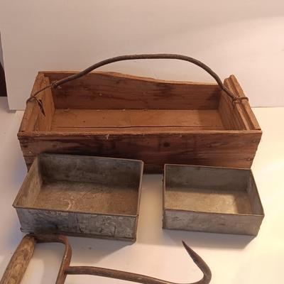 Antique wooden box with two metal boxes some old bottles and a vintage hay hook