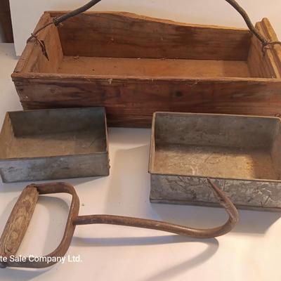 Antique wooden box with two metal boxes some old bottles and a vintage hay hook