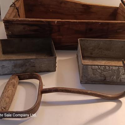 Antique wooden box with two metal boxes some old bottles and a vintage hay hook