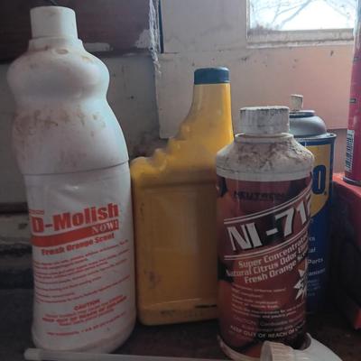 Garage / Automobile chemicals full to almost full bottles and containers