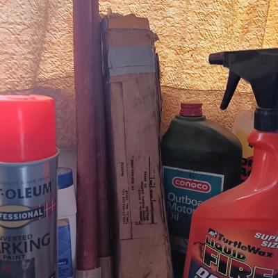 Garage / Automobile chemicals full to almost full bottles and containers