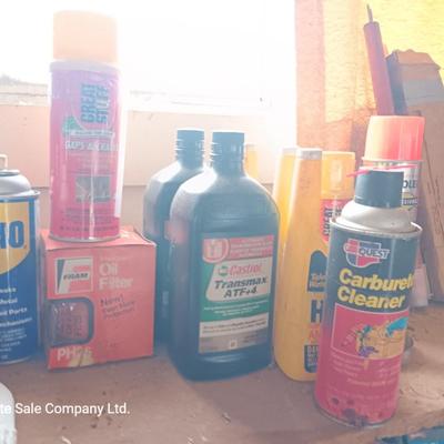 Garage / Automobile chemicals full to almost full bottles and containers