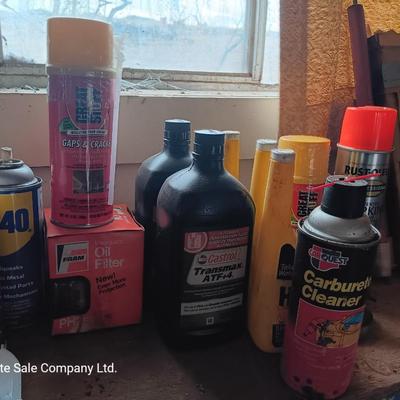 Garage / Automobile chemicals full to almost full bottles and containers