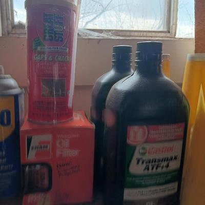 Garage / Automobile chemicals full to almost full bottles and containers