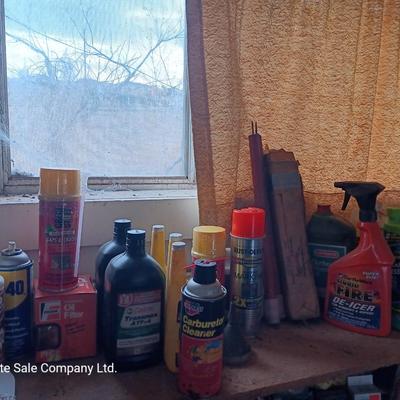 Garage / Automobile chemicals full to almost full bottles and containers