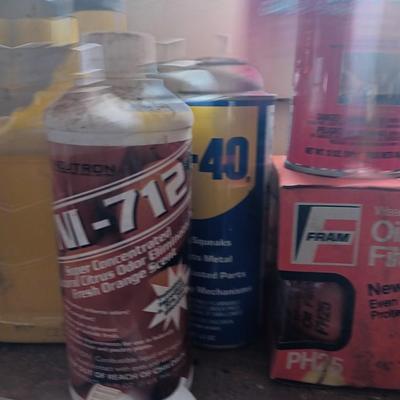 Garage / Automobile chemicals full to almost full bottles and containers