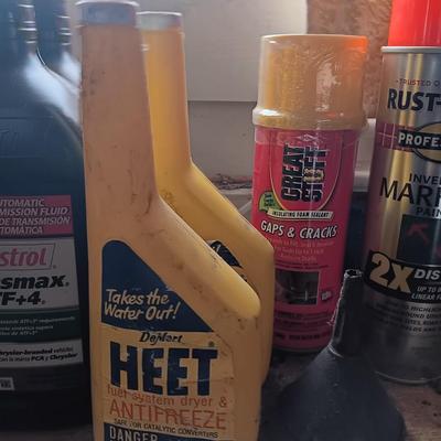 Garage / Automobile chemicals full to almost full bottles and containers