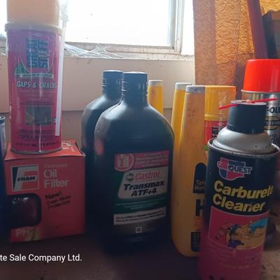 Garage / Automobile chemicals full to almost full bottles and containers