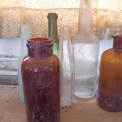 Variety of vintage glass bottles