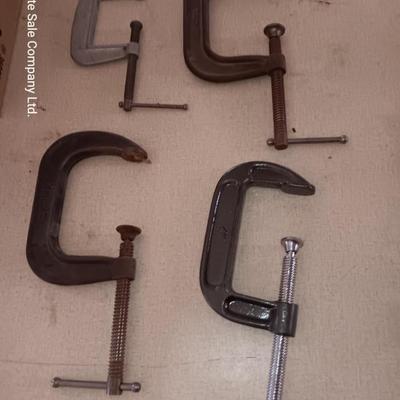 Four metal T handled clamps