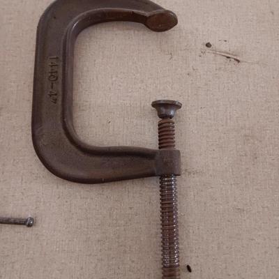 Four metal T handled clamps